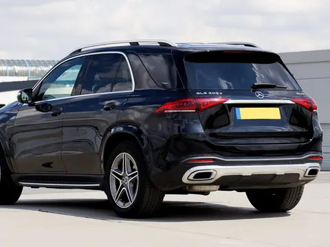 Rear glass of a black SUV in a lot